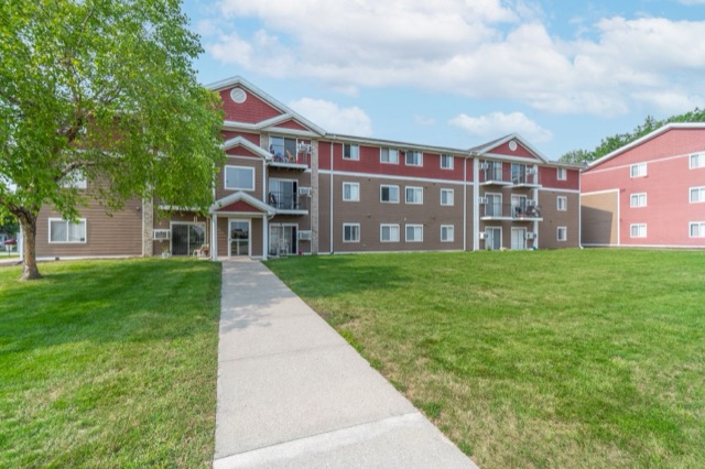 Aspen apartment buildings with off-street parking and lawn
